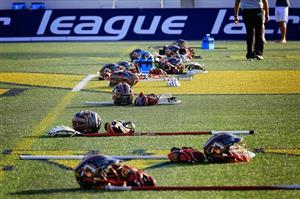 Lacrosse gear sitting on field